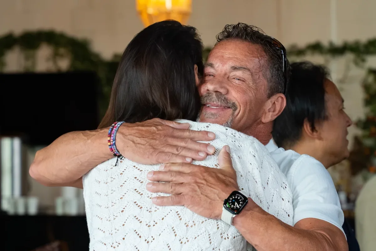 A long hug between participants at WeDeepen In-Person