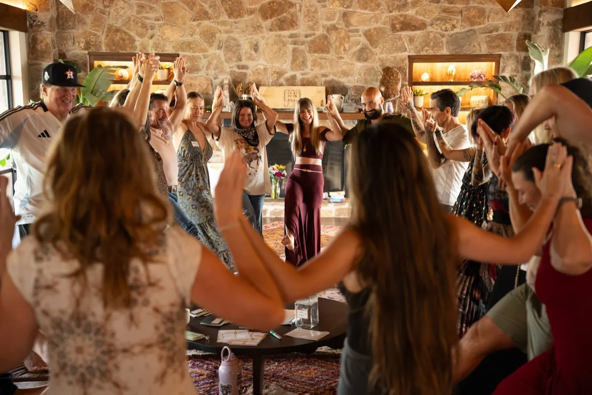 The group in a joyful circle at a Love Immersion