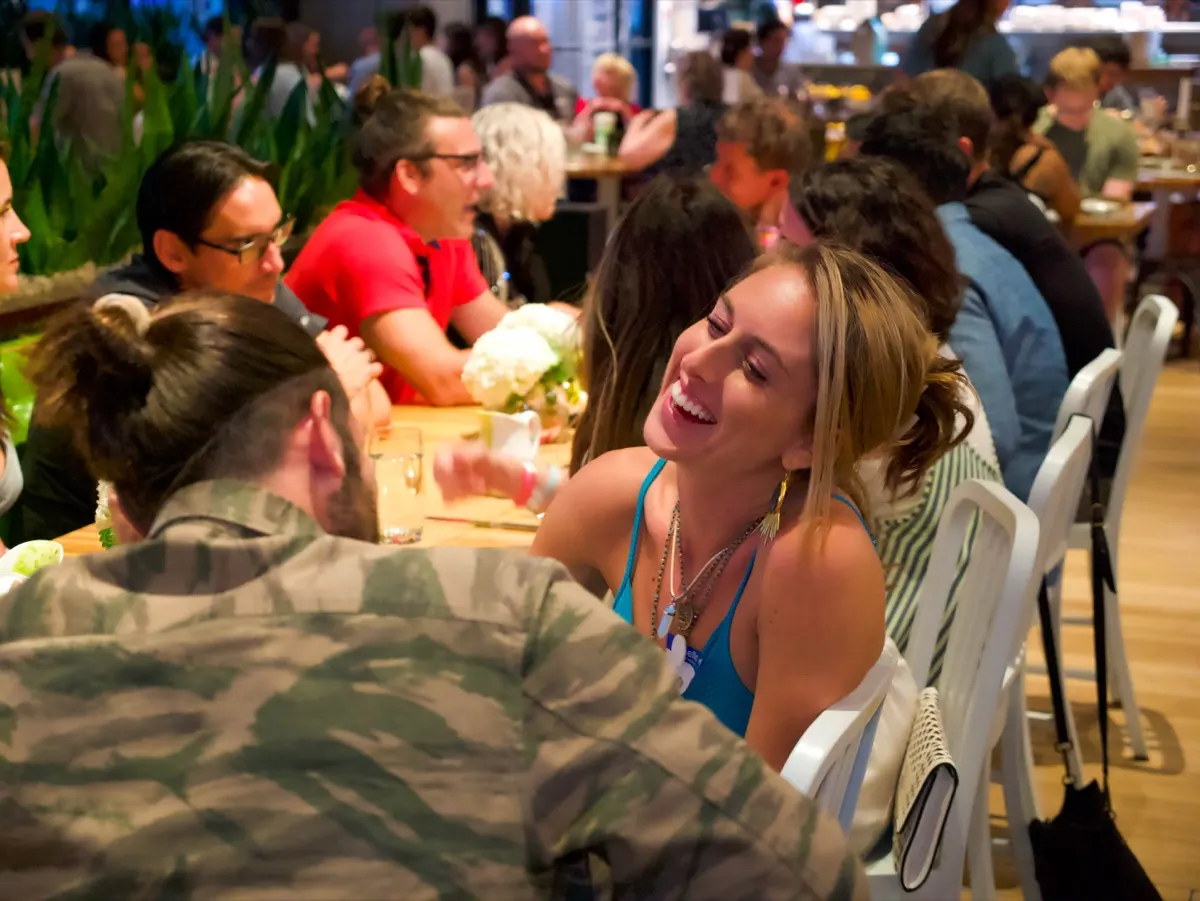 Laughing over dinner together at a Love Immersion